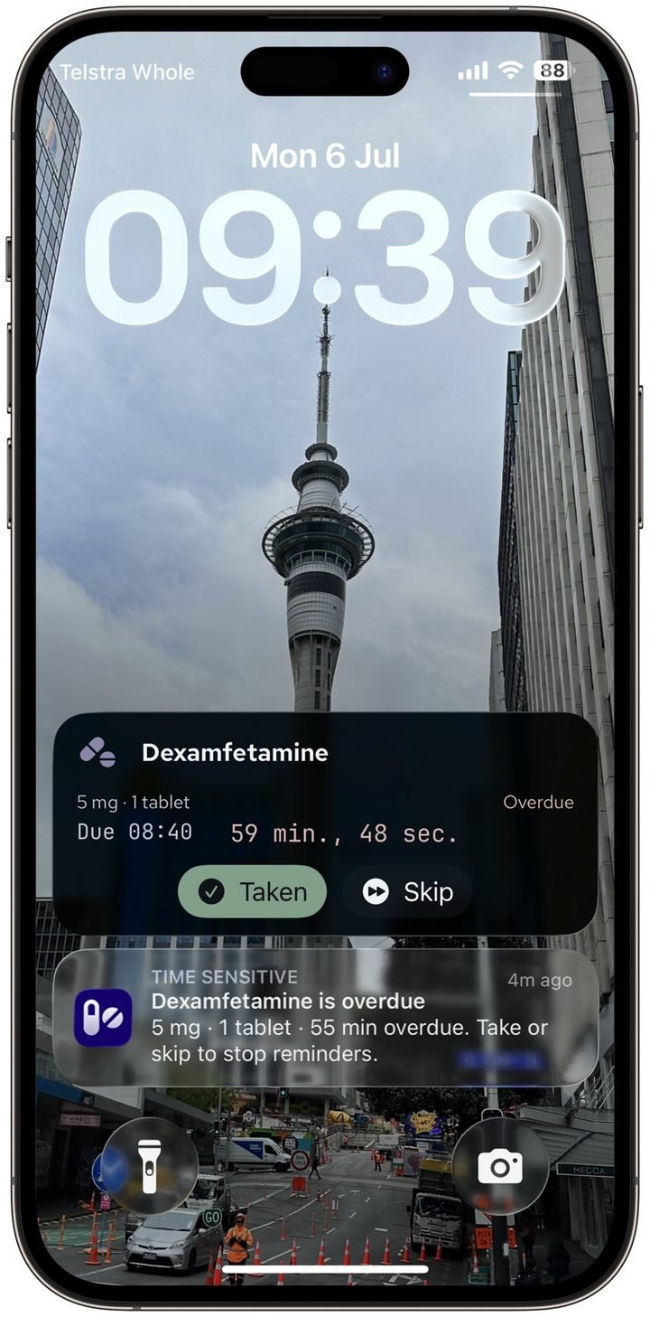 Lock screen showing a Dexamfetamine Live Activity — 5 mg, 1 tablet, due 08:40 — with a live overdue counter and Taken and Skip buttons, above a Time Sensitive reminder notification